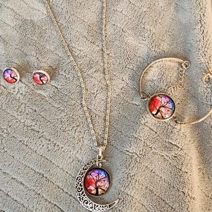 Necklace, bracelet, and earrings set.